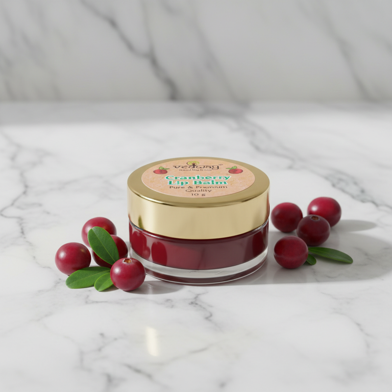 Cranberry Lip Balm on marble with fresh cranberries